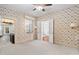 Bedroom with floral wallpaper, plush carpet, large windows, and an attached bathroom at 212 W University Dr, Chapel Hill, NC 27516