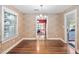 Dining room with hardwood floors and natural light that provides a cozy and inviting space at 212 W University Dr, Chapel Hill, NC 27516