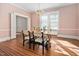 Elegant dining room featuring hardwood floors and a chandelier at 212 W University Dr, Chapel Hill, NC 27516