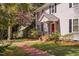 Charming two-story home with manicured lawn and brick pathway at 212 W University Dr, Chapel Hill, NC 27516
