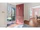 Inviting foyer with hardwood floors and a glimpse of the dining room at 212 W University Dr, Chapel Hill, NC 27516