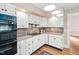 Stylish kitchen features white cabinets and granite countertops at 212 W University Dr, Chapel Hill, NC 27516