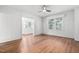Living room with hardwood floors, neutral paint, and an abundance of natural light from large windows at 212 W University Dr, Chapel Hill, NC 27516