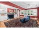 Spacious living room features hardwood floors, fireplace, and built-in shelves at 212 W University Dr, Chapel Hill, NC 27516