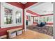 Bright living room features hardwood floors and leads to additional living spaces at 212 W University Dr, Chapel Hill, NC 27516