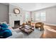 Cozy living room with a fireplace and comfortable seating at 212 W University Dr, Chapel Hill, NC 27516