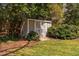 Outdoor shed surrounded by lush trees and foliage in the backyard at 212 W University Dr, Chapel Hill, NC 27516