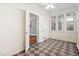 Enclosed sunroom with checkered floors, ceiling fan and bright, natural light at 212 W University Dr, Chapel Hill, NC 27516