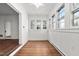 Sunroom with hardwood floors, white walls, and plenty of natural light from the windows at 212 W University Dr, Chapel Hill, NC 27516