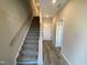 Entryway featuring stairs, wood-look floors, and neutral walls at 219 Adobe Pl, Cary, NC 27519