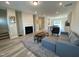 Spacious living room featuring modern furniture, a cozy fireplace, and beautiful flooring, perfect for entertaining at 219 Adobe Pl, Cary, NC 27519