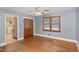 Nice bedroom with hardwood floors, closet and ceiling fan at 2246 Hillandale Rd, Durham, NC 27705
