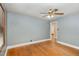 Inviting bedroom with neutral tones, hardwood floors and ceiling fan at 2246 Hillandale Rd, Durham, NC 27705