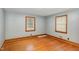 Comfortable bedroom featuring hardwood floors and natural lighting at 2246 Hillandale Rd, Durham, NC 27705