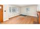 Bright living room showcasing hardwood floors and large windows for natural light at 2246 Hillandale Rd, Durham, NC 27705