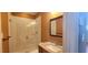 Cozy bathroom featuring glass shower, and granite countertops at 2429 Falls River Ave, Raleigh, NC 27614