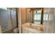 Bathroom featuring a vanity with a mirror and a shower/tub combination with a curtain at 2429 Falls River Ave, Raleigh, NC 27614