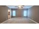 Spacious bedroom featuring neutral carpeting, ample natural light and en suite bathroom at 2429 Falls River Ave, Raleigh, NC 27614