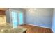 Breakfast nook with granite countertops, French doors, and hardwood floors at 2429 Falls River Ave, Raleigh, NC 27614