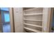 Walk-in closet featuring shelving and carpeted floors at 2429 Falls River Ave, Raleigh, NC 27614
