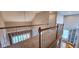 Second story hallway with carpet and railing overlooking the lower level at 2429 Falls River Ave, Raleigh, NC 27614
