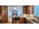 Gourmet kitchen with granite countertops and stainless steel appliances, open to the living area at 2429 Falls River Ave, Raleigh, NC 27614