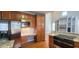 Kitchen featuring stainless steel appliances, a built in desk, and granite countertops at 2429 Falls River Ave, Raleigh, NC 27614