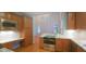 Well-equipped kitchen with updated appliances and a granite countertop at 2429 Falls River Ave, Raleigh, NC 27614