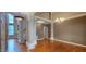 Spacious living room with hardwood floors, abundant light, and decorative lighting at 2429 Falls River Ave, Raleigh, NC 27614