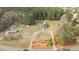 Aerial view of the property showcasing the home, outbuildings, large lot, and circular driveway at 2505 Egypt Mountain Rd, Kittrell, NC 27544