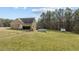Expansive backyard with a garage, above ground pool, and storage shed, providing ample space for recreation at 2505 Egypt Mountain Rd, Kittrell, NC 27544