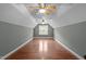 Spacious bonus room featuring hardwood floors and multiple ceiling fans at 2505 Egypt Mountain Rd, Kittrell, NC 27544