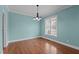 Inviting dining room with hardwood floors, soft blue walls, and elegant chandelier at 2505 Egypt Mountain Rd, Kittrell, NC 27544