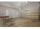 A spacious two car garage with high ceilings and ample room for vehicles and storage at 2505 Egypt Mountain Rd, Kittrell, NC 27544