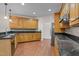 Well-equipped kitchen with custom cabinetry, granite countertops, and modern appliances at 2505 Egypt Mountain Rd, Kittrell, NC 27544