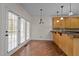 Eat-in kitchen with lots of windows and natural light, wooden cabinets, and a breakfast bar at 2505 Egypt Mountain Rd, Kittrell, NC 27544