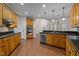 Beautiful kitchen with custom cabinetry, granite countertops, and stainless steel appliances at 2505 Egypt Mountain Rd, Kittrell, NC 27544