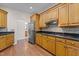 Well-equipped kitchen with custom cabinetry, granite countertops, and modern appliances at 2505 Egypt Mountain Rd, Kittrell, NC 27544