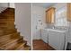 View of the laundry room with stairs nearby, offering convenience and accessibility at 2505 Egypt Mountain Rd, Kittrell, NC 27544