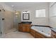 Main bathroom with walk-in shower, vanity sink, and jetted tub at 2505 Egypt Mountain Rd, Kittrell, NC 27544