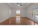 Spacious main bedroom with tray ceilings, ceiling fan, access to a deck, and an en-suite bathroom at 2505 Egypt Mountain Rd, Kittrell, NC 27544