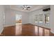 Spacious main bedroom with tray ceilings, ceiling fan, access to a deck, and an en-suite bathroom at 2505 Egypt Mountain Rd, Kittrell, NC 27544