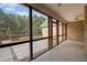 This screened porch overlooks the beautiful backyard and provides a seamless transition to the wooden deck at 2505 Egypt Mountain Rd, Kittrell, NC 27544