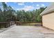 Large wooden deck overlooking a private backyard with mature trees, ideal for gatherings and outdoor enjoyment at 2505 Egypt Mountain Rd, Kittrell, NC 27544