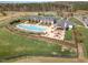 Aerial view showcasing the community clubhouse with a pool, cabana and other amenities at 251 North Crest Dr, Chapel Hill, NC 27517