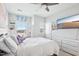 Well-lit bedroom with a ceiling fan, television and ample natural light, creating a relaxing atmosphere at 251 North Crest Dr, Chapel Hill, NC 27517