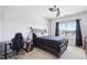 Cozy bedroom featuring a ceiling fan, natural light from the window, and a functional desk setup at 251 North Crest Dr, Chapel Hill, NC 27517