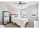 Bright bedroom with a large mirror, ceiling fan and natural light, creating a peaceful atmosphere at 251 North Crest Dr, Chapel Hill, NC 27517