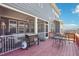 Outdoor deck with a gas grill and dining set, ideal for entertaining and enjoying outdoor meals at 251 North Crest Dr, Chapel Hill, NC 27517