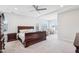 Spacious main bedroom with tray ceilings, large windows, and cozy sitting area at 251 North Crest Dr, Chapel Hill, NC 27517